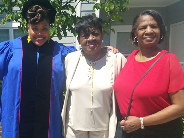 Luisi when she graduated from the University of Kansas, along with her grandaunt, Erma Butler (center)and her mother, Debra Robinson (far right).