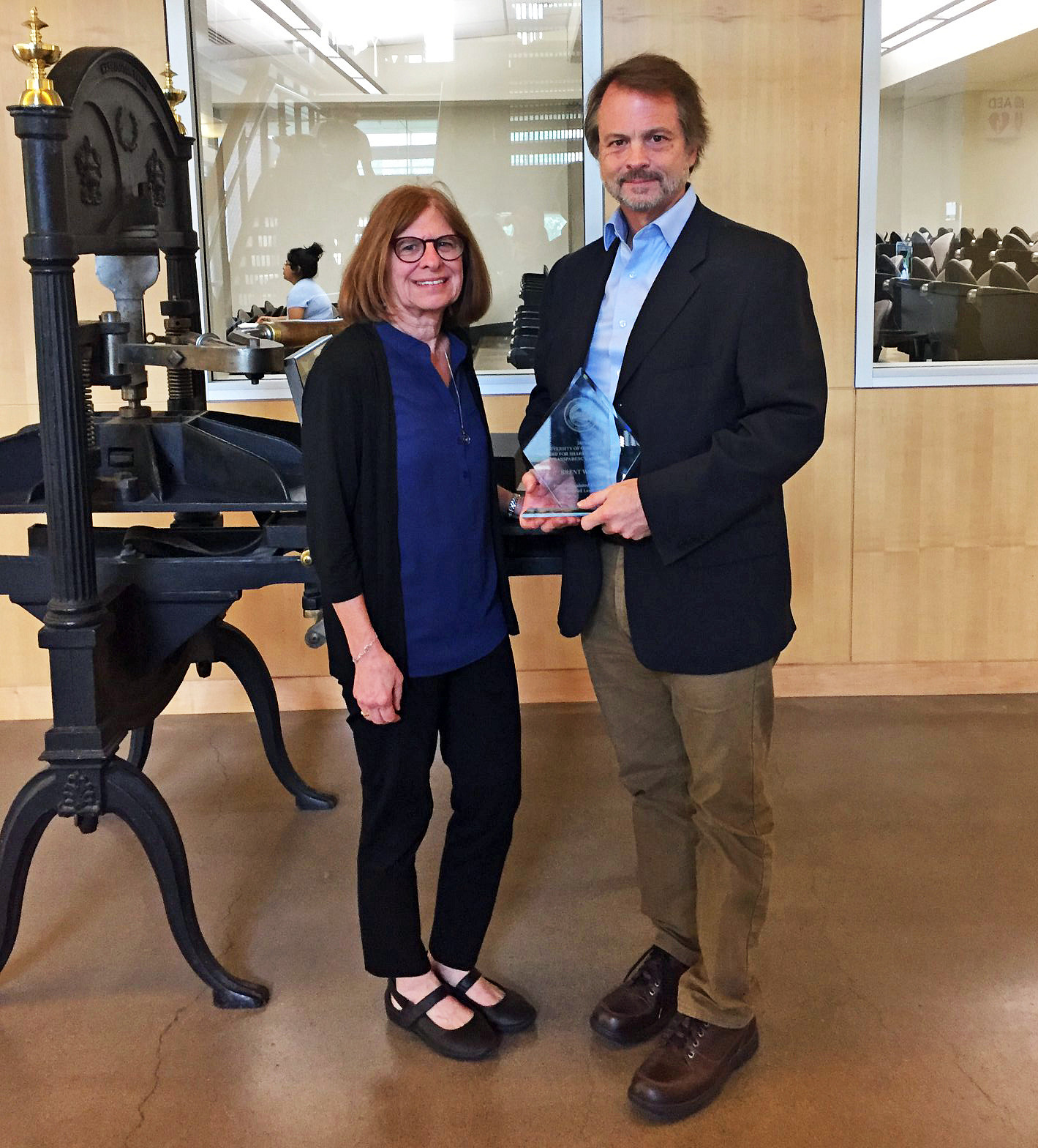 Brent Walth won the 2019 University Senate Shared Governance, Transparency, and Trust Award. He is pictured here with SOJC Senior Associate Dean Leslie Steeves, who nominated him for the award. Photo courtesy of Catalyst Journalism Project, a program co-founded by Brent Walth.