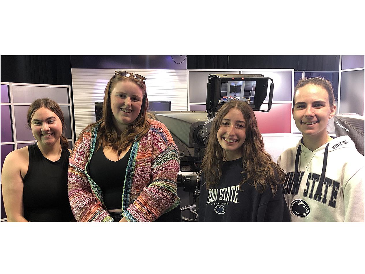 Members of the production team for 2023 Homecoming parade include (from left) preshow video director Georgia Peters, producer Eliza Casey, director Abby Kachur and technical director Gabriella Voccio. Credit: Penn State. Creative Commons