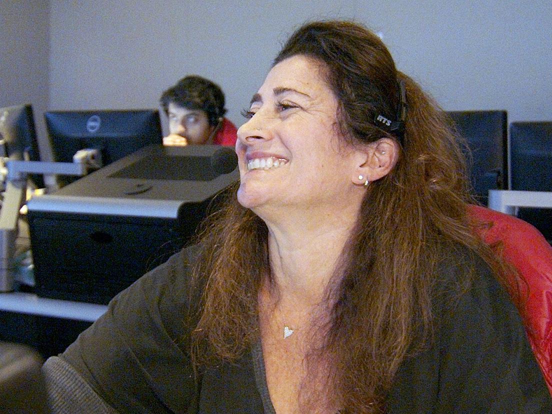 Deb Gelman, coordinating producer of "That Other Pregame Show," smiles from her seat in the control room as another four-hour weekly episode comes to a close.   Credit: Scott Myrick. All Rights Reserved.